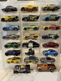 collection of die-cast toy cars from the Disney and Pixar Cars franchise.  The collection features various characters, including the local police offi