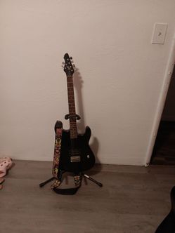 Beginner first act electric guitar with stand and strap
