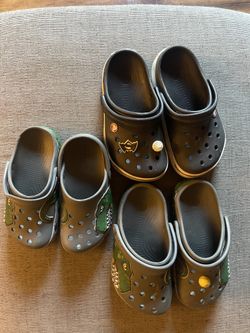 CROCS… J1 Black And dino Pair… C12 Dino Pair Lights Up. $10 Each