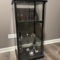 Glass Display Case with Decorative Sculptures