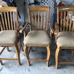 Three matching tall barstools