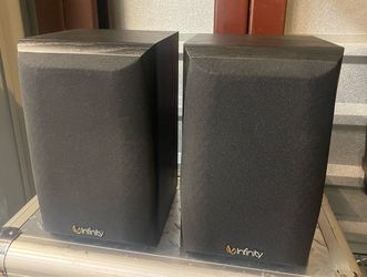Speakers. Two Infinity Primus 140 bookshelf speakers. Clear and powerful sound output. Ideal for home audio.