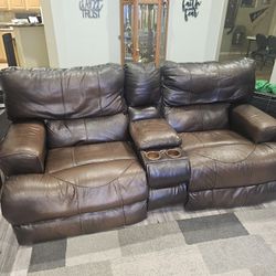 Italian leather love seat electric