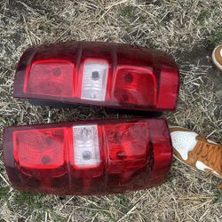 tail light assembly, from a 2007-2014 Chevrolet Suburban 1500 or a 2007-2013 Chevrolet Avalanche.