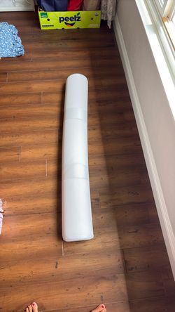 Long pillow for edge of bed