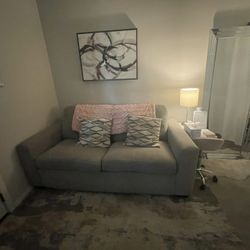 Grey Couch. Foldable Bed inside.