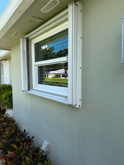 Accordion storm shutters, White