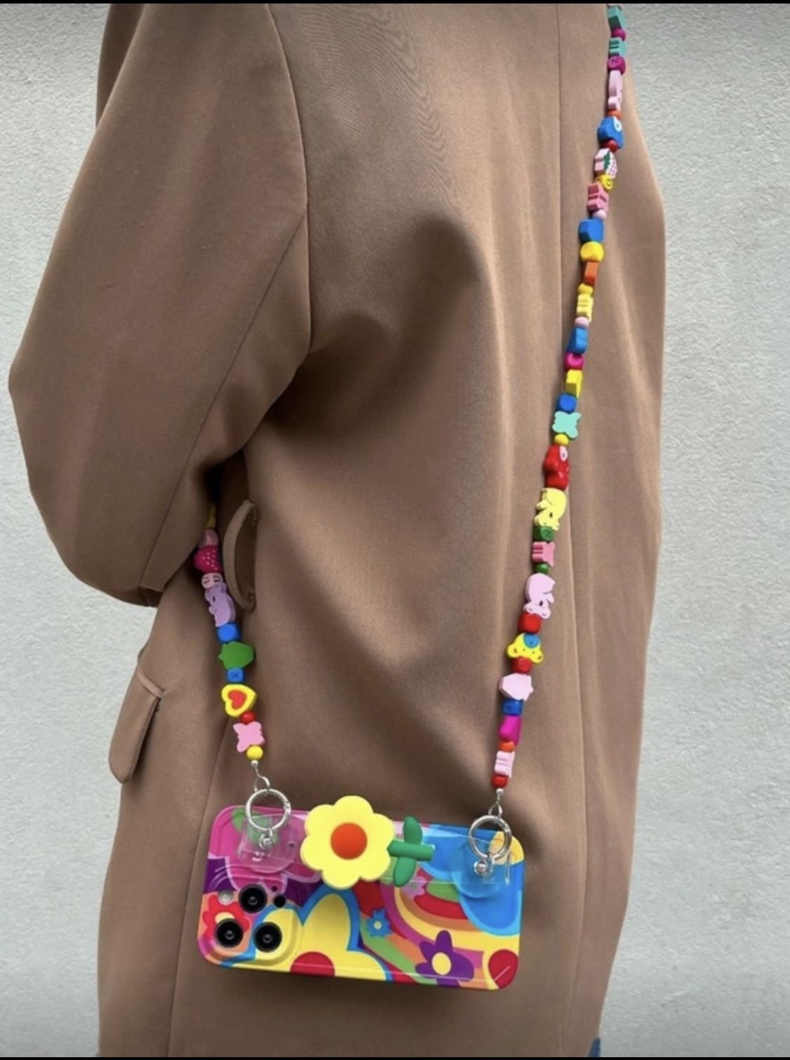 Colorful Beaded IPhone 13 Pro Max Case with Strap Vibrant phone case with a colorful beaded strap. Features a playful design with flowers and pattern