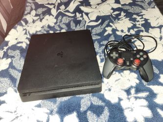Slim PS4 with Controller and cords. Used and Works Great