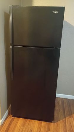 black Whirlpool top-freezer refrigerator