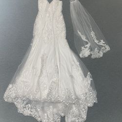 Adult ivory wedding woman’s dress worn once like new please read description for measurements etc.