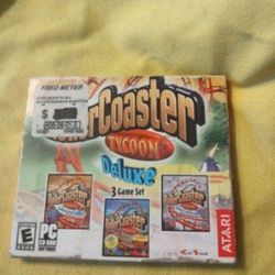 True hard to find factory sealed Rollercoaster tycoon Deluxe Pc Game From Atari 