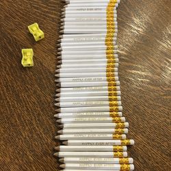 Bridal shower game pencils. White with gold lettering that say Happily Ever After. 45 pencils with erasers and two pencil sharpeners