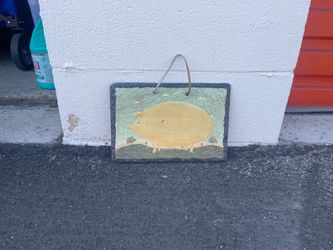 Hand painting on natural slate stone with rough edges