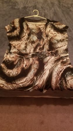 Torrid Sleeveless V-neck Top with Decorative Belt.