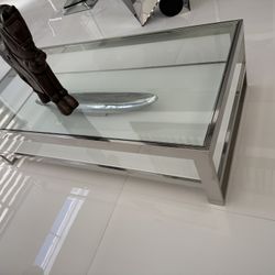 Rectangle  Coffee Table, Heavy, was $1,100. Stainless Steel Frame, Tempered Glass, Perfect Condition Size: 55W x 15H x 27.                      