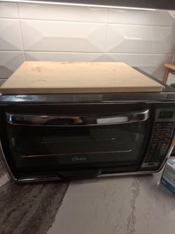 Poster toaster oven and pizza stone used works great
