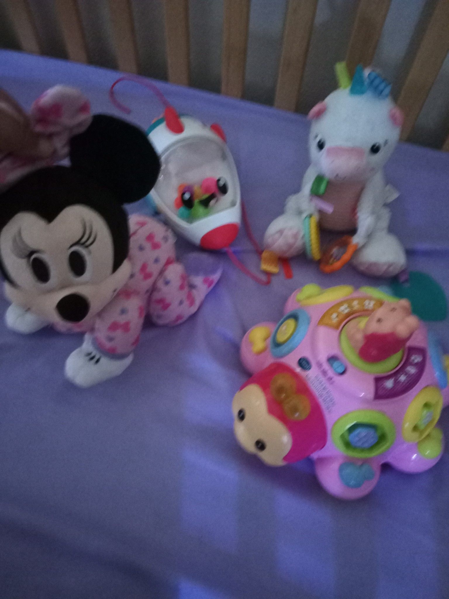 Disney's crawling Minnie mouse and other light up animated toy a unicorn rattle and a rocketship popper great for babies