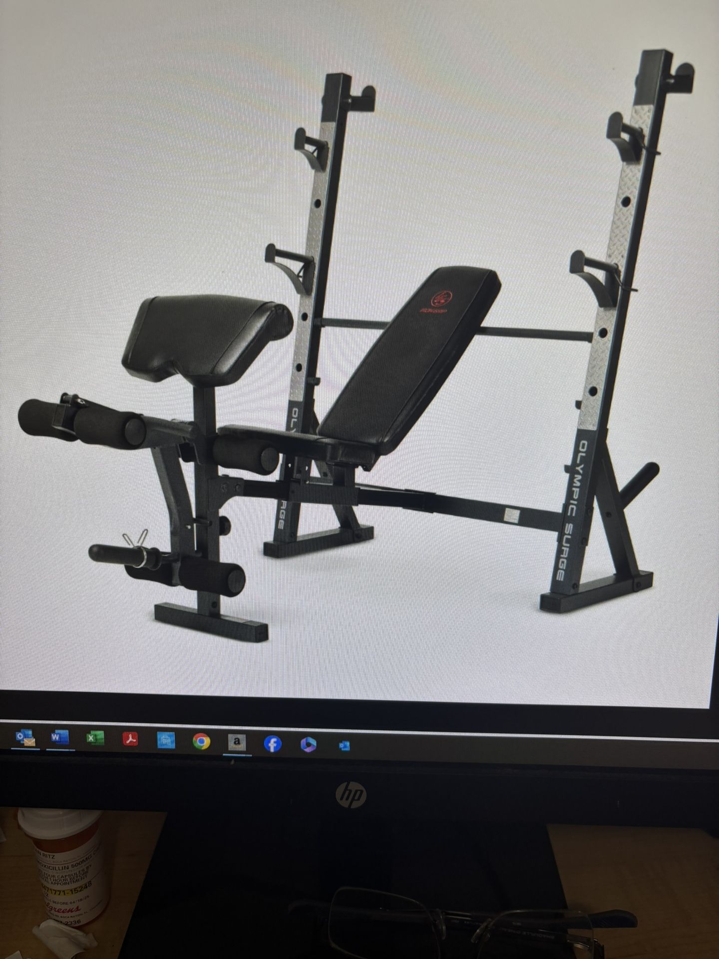 Olympic surge weight bench with weights and 7 Foot Barbell