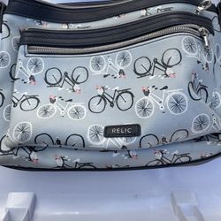 Relic crossbody bag with a bicycle print.