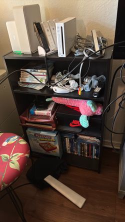 2 black stands with 3 shelves each on both