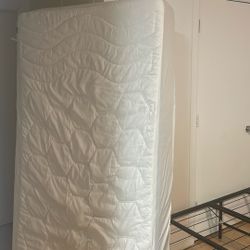 Twin XL bed with White  Cover 