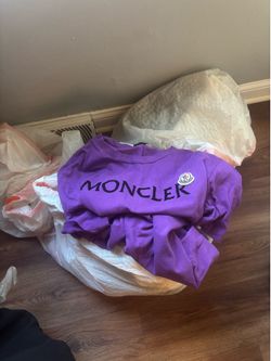Men’s Moncler shirt and pair of Jordans