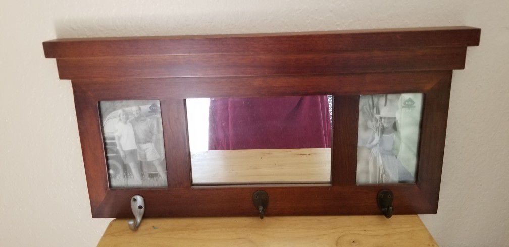 11x22 Wall Hanging Has Mirror In Center  & A Photo Frame On Each Side And 3 Hooks On Bottom. Is Wooden.  