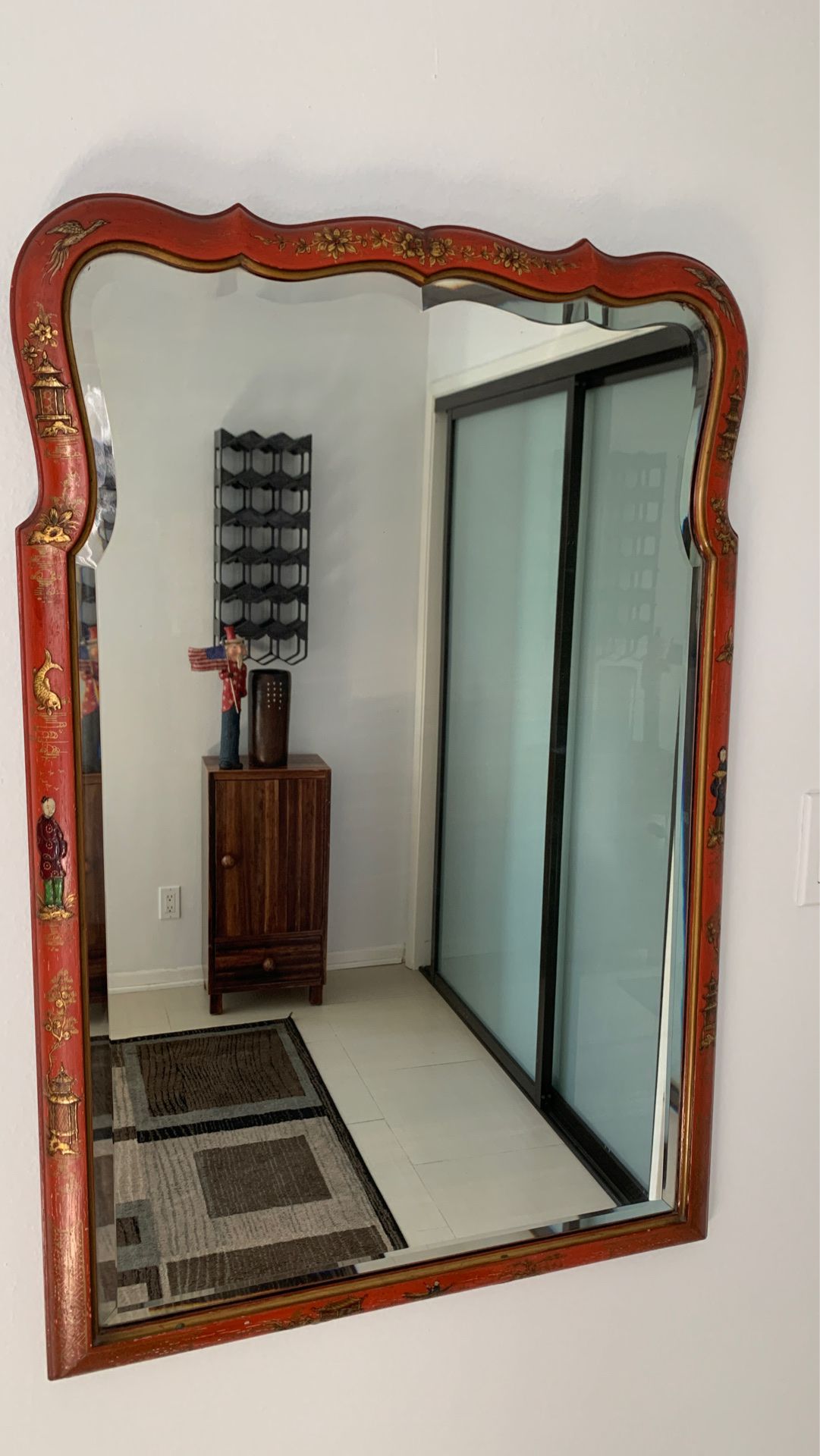 Antique Asian carved mirror with beveled glass