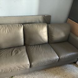 Macy’s Grey leather couch in great condition!