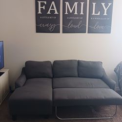 Clean gray sectional couch with pull out extender piece
