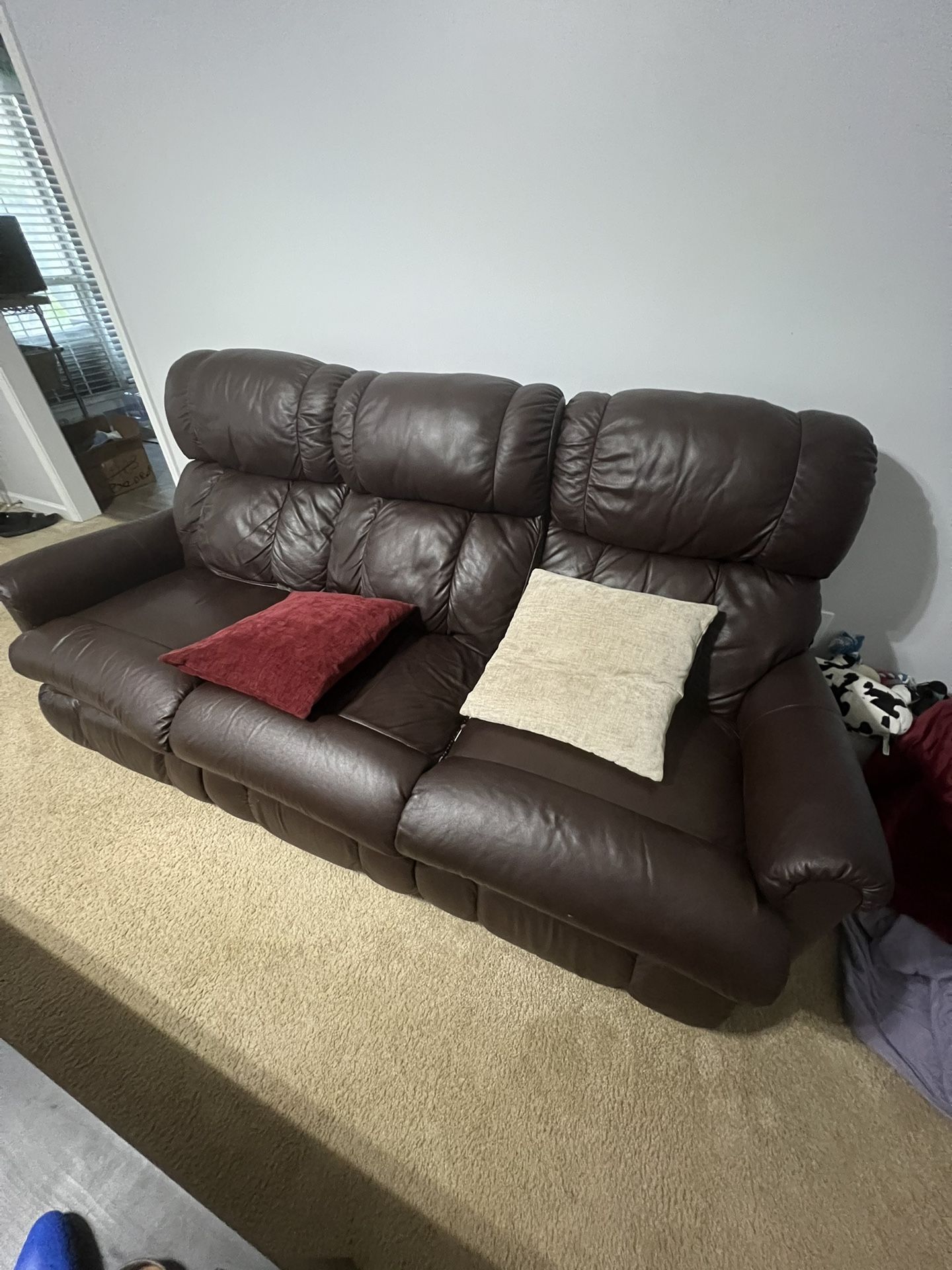 Brown leather sofa couch. both side seats recline.