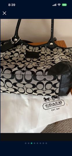 It’s A Beautiful COACH Bag It’s Barely Used The Color Is Black And Gray