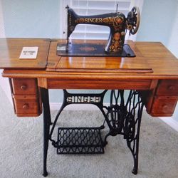 Antique 1910 Singer treadle sewing machine with cabinet Model 66 "Red Eye"