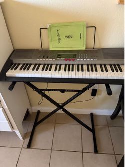 Used Casio keyboard with the stand