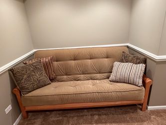 Tan futon/bed Tan futon/bed