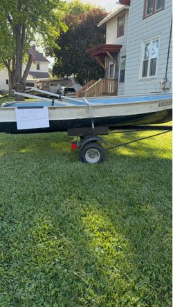 12 foot Row boat with five horse mercury motor