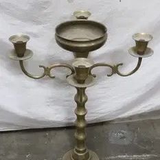 A large brass/ bronze floor candle holder, 29.85"x24.2"x24.2"