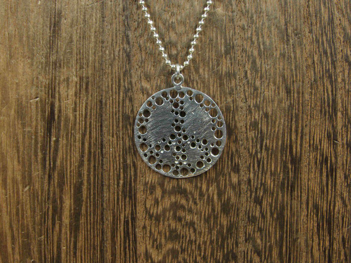 16 Inch Sterling Silver Odd Circle Pattern Pendant Necklace