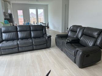 Dark gray recliner sofa, and loveseat