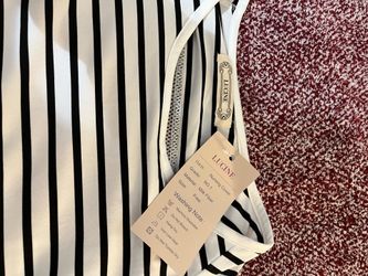Super sweet breast-feeding cover-up brand new with tags with a pocket great gift for the new mom