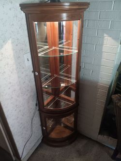 Small lighted curio cabinet