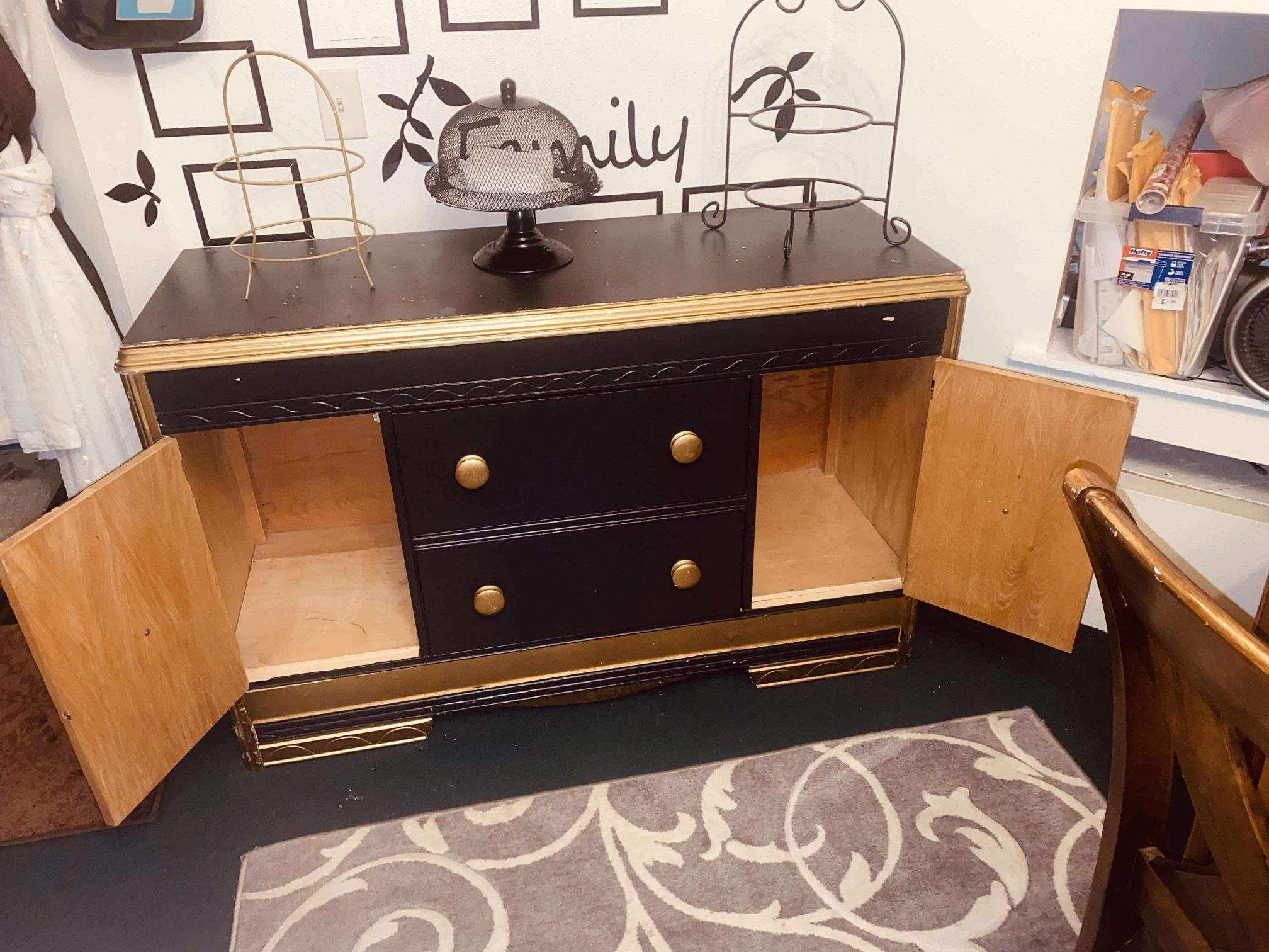 $180- (firm on price)1 Black and gold Vintage dresser! Lots of storage space behind each side door. H-2‘10“ X L 4 ft 4 1/2” X D 1‘7“ Could use a rep