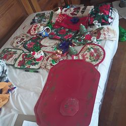 A box full of different Christmas stuff pot holders candles holder all for $25