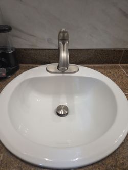 Bathroom: 2 sink basins + 2 faucets