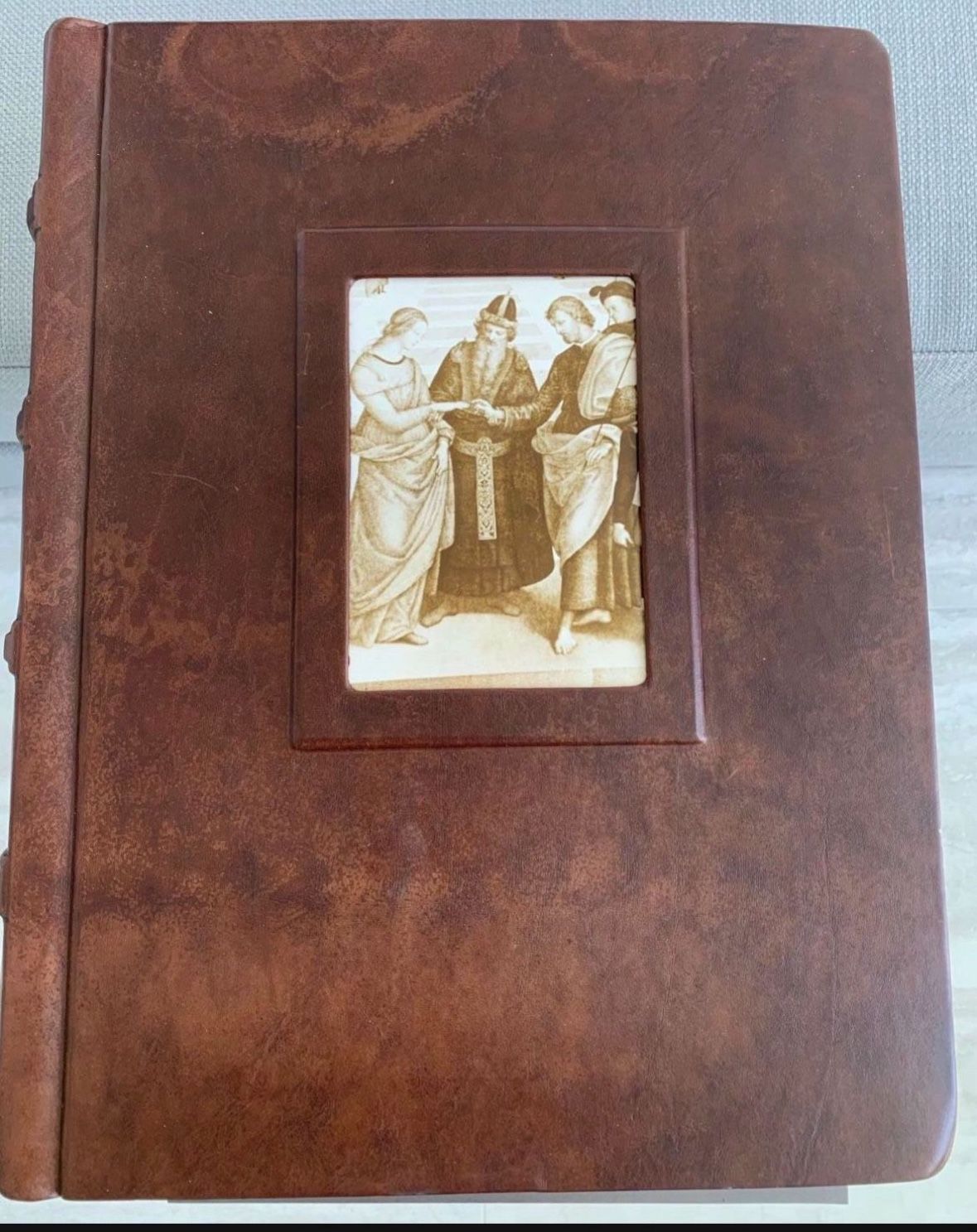 So Unique! Brown, leather bound 50 page scrapbook. Each page has a paper protective covering for items for the book. Never used Great condition.