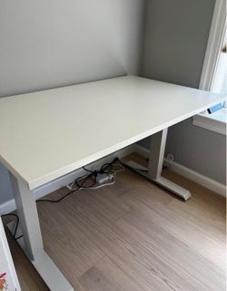 White electric standing desk