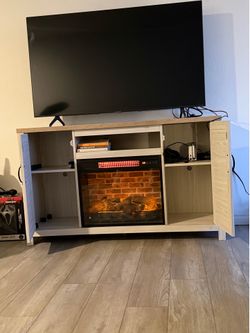 Tv stand w| built in fire place