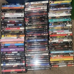 Huge lot of DVDs , VHS and books