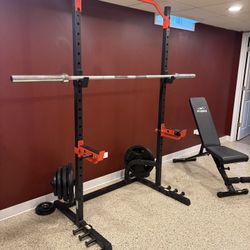 Squat Rack With Rubber Plates Barbell And Bench